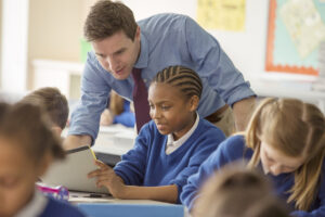 Teacher with his pupils in classroom